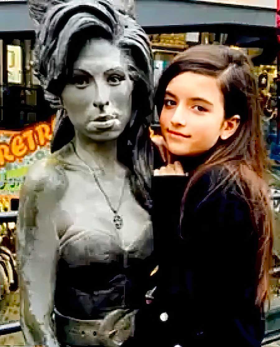 Angelina Jordan next to Amy Winehouse statue in London